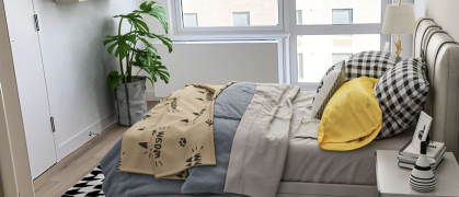 bedroom at apartment building in Rockaway Village, Queens with bed and building views